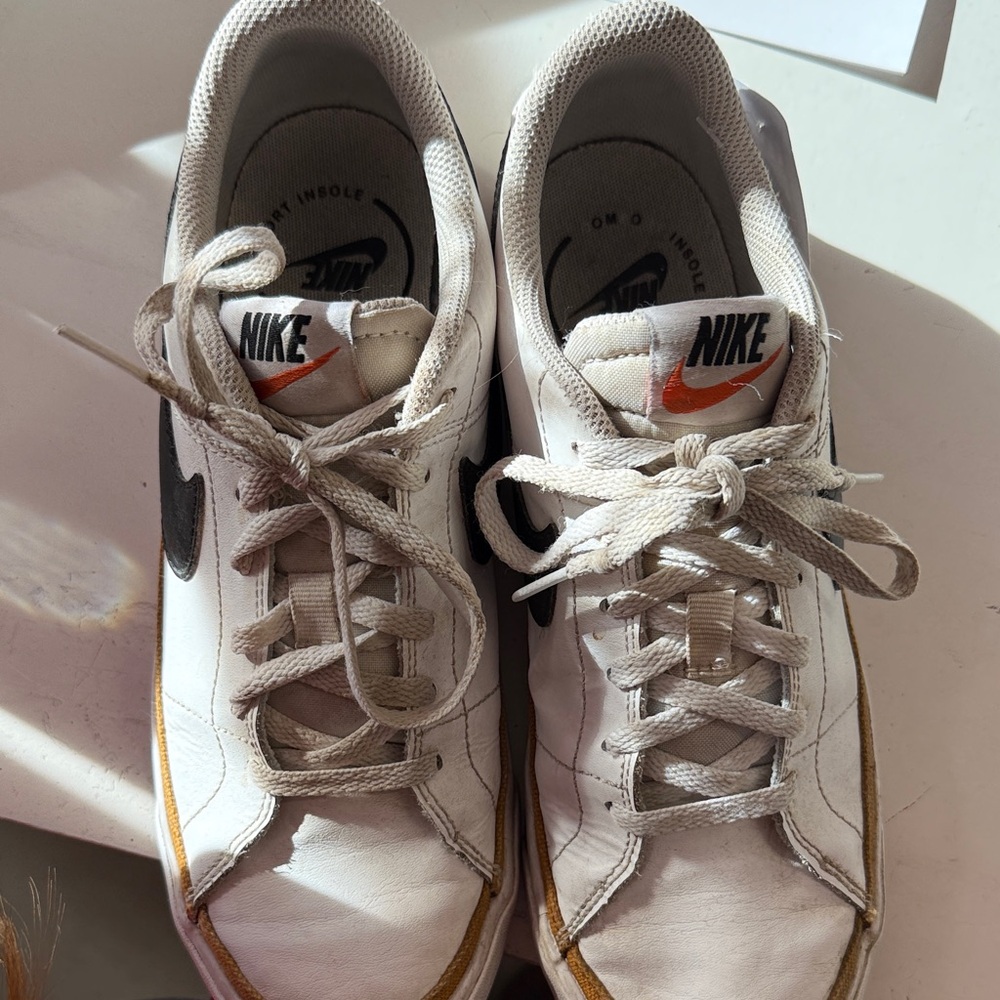 Nike White Sneakers with Black Swoosh and Gold Stripe - Picture 2 of 5